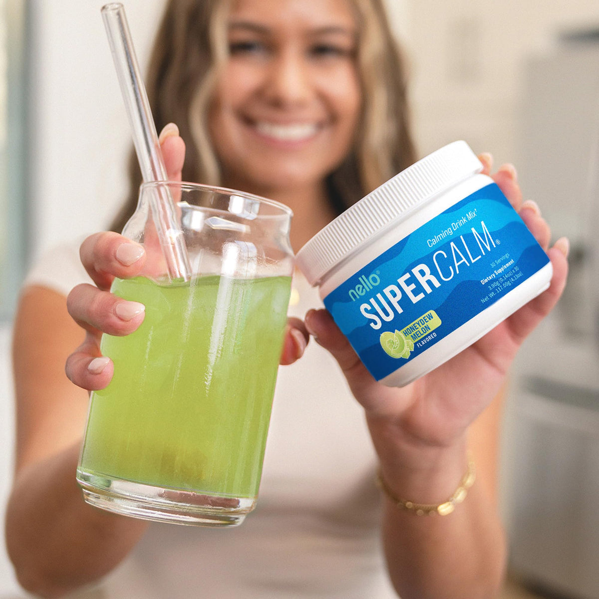 Nello Supercalm Poudre Boisson Melon Miel dans un verre d'eau