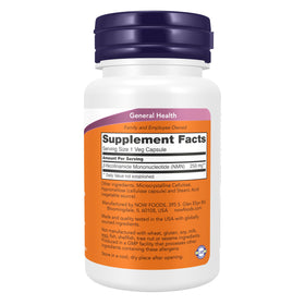NOW Foods NMN 250 mg capsules végétales sur une surface blanche