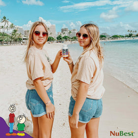 NuBest Tall 10+ capsules sur une table avec d'autres compléments alimentaires