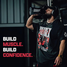 Nutrex Research Poudre de Créatine Fruit Punch en poudre dans un verre