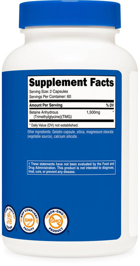 Nutricost Bétaïne Anhydre 750mg capsules près d'un verre d'eau