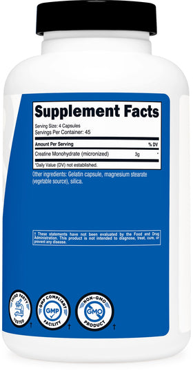 Nutricost Créatine Monohydrate 180 capsules à côté d'un verre d'eau
