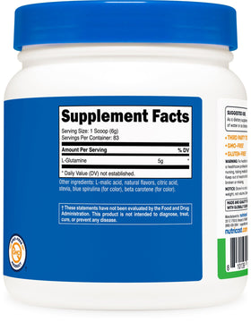 Nutricost Poudre de L-Glutamine 500g Saveur Pomme Verte sur une table en bois