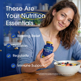 Nutrition Essentials Probiotiques comprimés en main