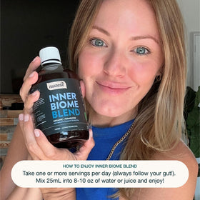 Nuzest Inner Biome Blend bouteille ouverte avec dose de 25ml
