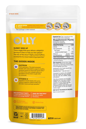 OLLY Hello Happy Gummies, deux gummies sur une table en bois