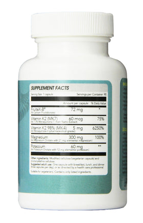Ortho Nutrition Decalcify posée sur une surface en bois