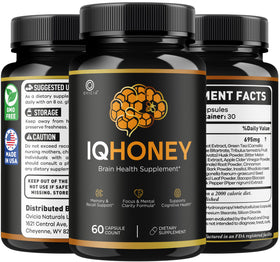 OVICIA IQHoney Capsules avec une main tenant la boîte