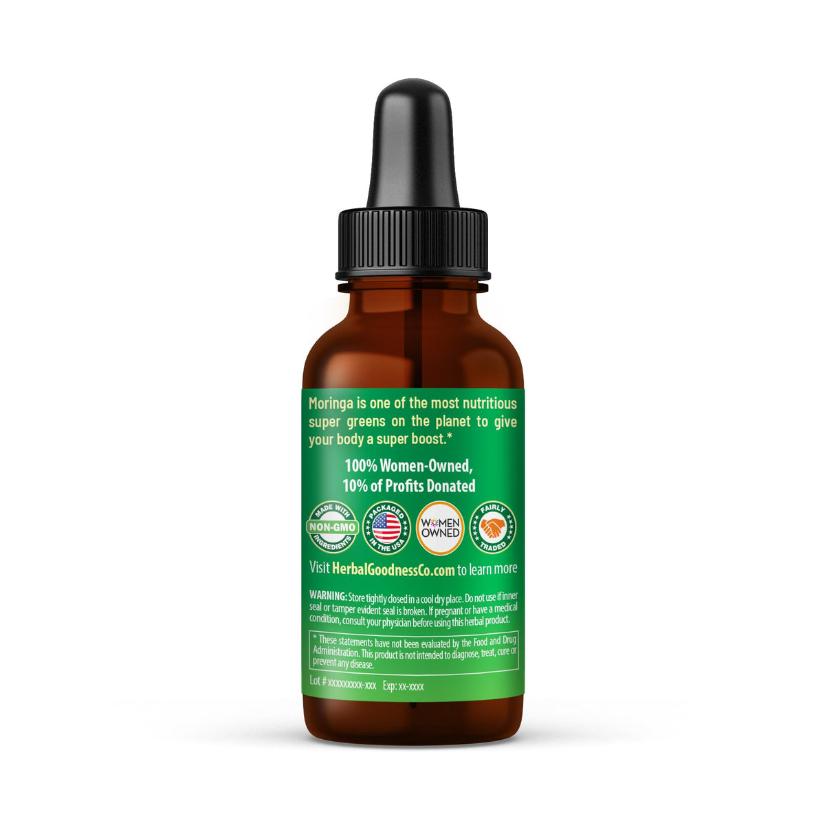 Pipette de l'extrait de Moringa Herbal Papaya au-dessus d'un verre