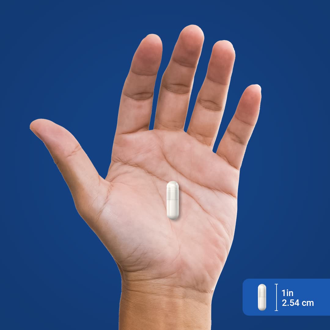 Piping Rock Niacine 500mg capsules à côté d'un verre d'eau