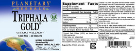 Planetary Herbals Triphala Gold 1000mg avec un verre d'eau