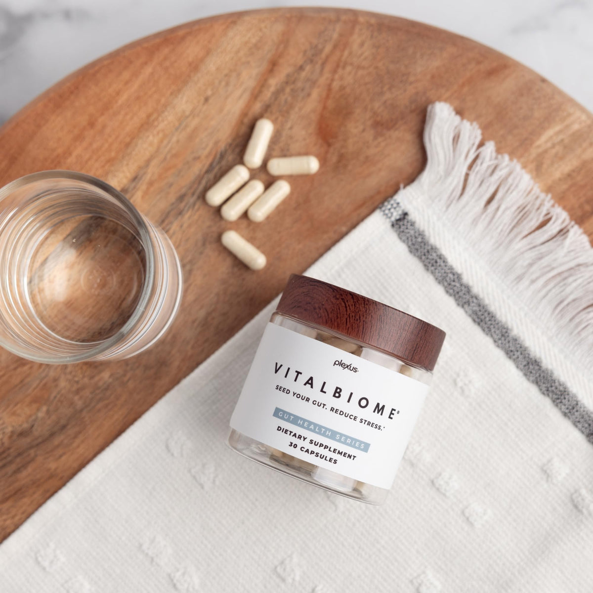 Plexus VitalBiome capsules ouvertes montrant la taille