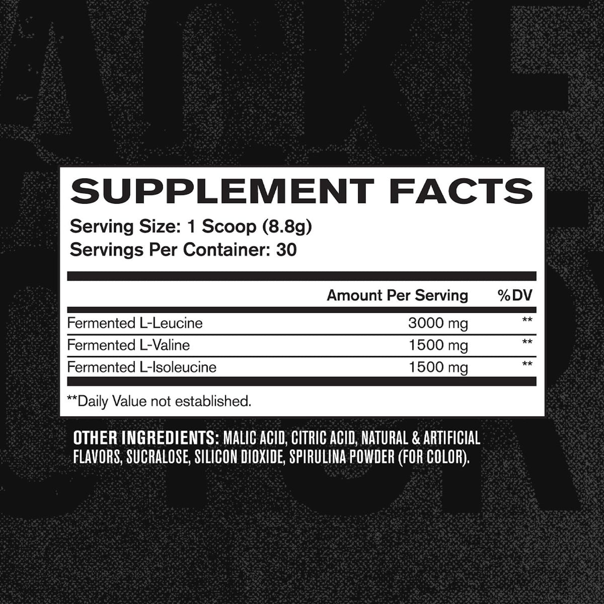Poudre BCAA Jacked Factory à côté d'équipements de fitness