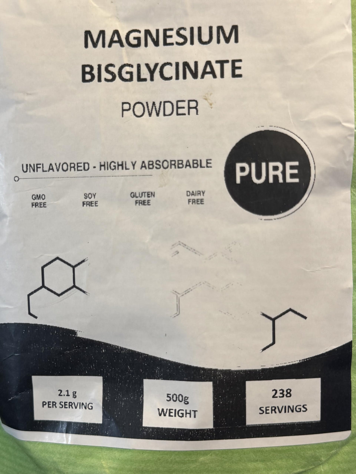 Poudre de bisglycinate de magnésium MS Finechem sur une cuillère