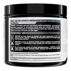 Poudre de créatine monohydrate Nutrex Research sur un plan de travail