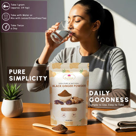 Poudre de gingembre noir MOUNTAIN ESSENTIALS dans un verre d'eau