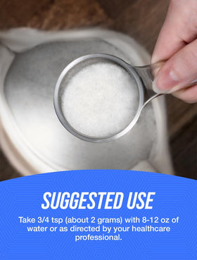 Poudre de Pyruvate de Calcium BulkSupplements 250g sur une table avec cuillère