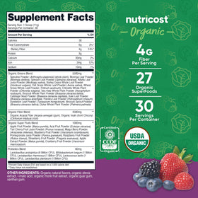 Poudre de super greens bio Nutricost avec cuillère doseuse à côté