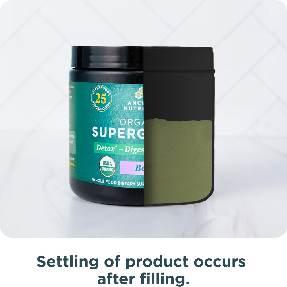 Poudre Super Greens Bio Ancient Nutrition sur une table