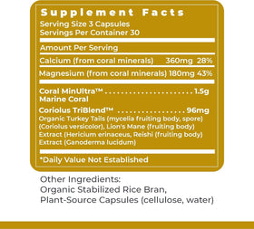 Premier Research Labs Calcium Magnesium Plus capsules on a wooden table