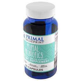 Primal Blueprint Primal Probiotics prise de capsules avec un verre d'eau