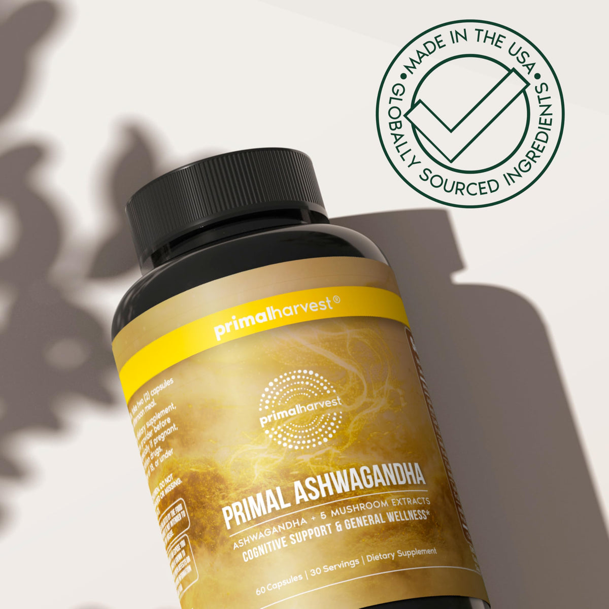 Primal Harvest Ashwagandha près d'un ordinateur et d'un carnet