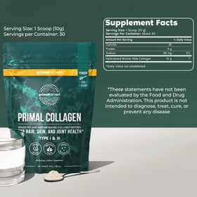 Primal Harvest Collagène Poudre 331g avec une cuillère doseuse sur une table