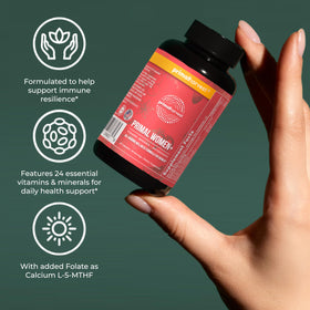 Primal Harvest Primal Womens+ capsules dans une main