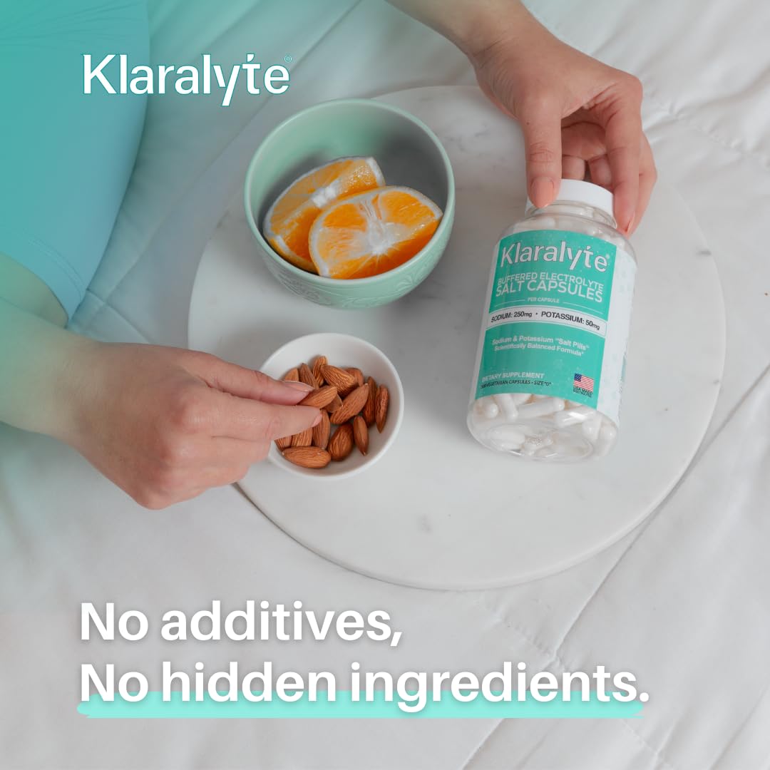 Prise de capsules KLARALYTE avec un verre d'eau