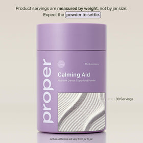 Proper The Lavenders Calming Aid powder in a glass with water