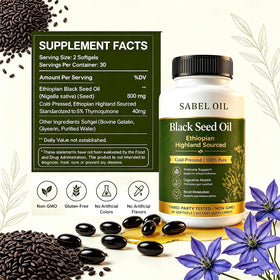Sabel Oil Huile de Graine Noire Éthiopienne gélules ouvertes sur une table