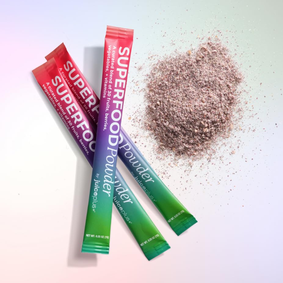 Sachets de Juice Plus+ Mélange de Superaliments sur une table
