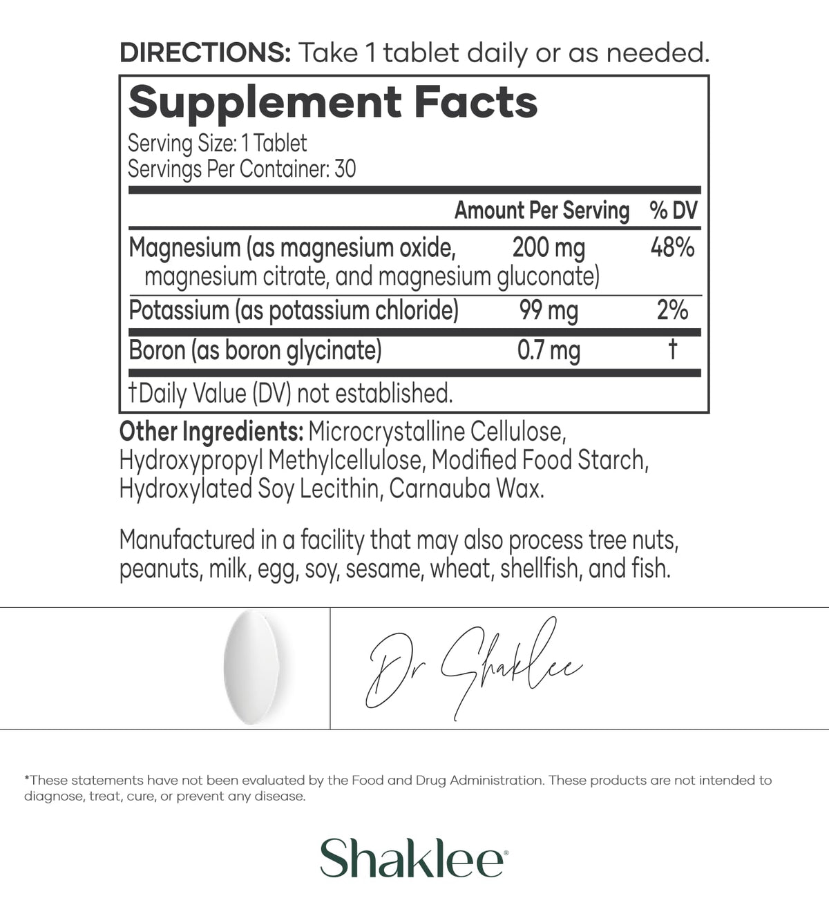 Shaklee VitalMag comprimés dans une main