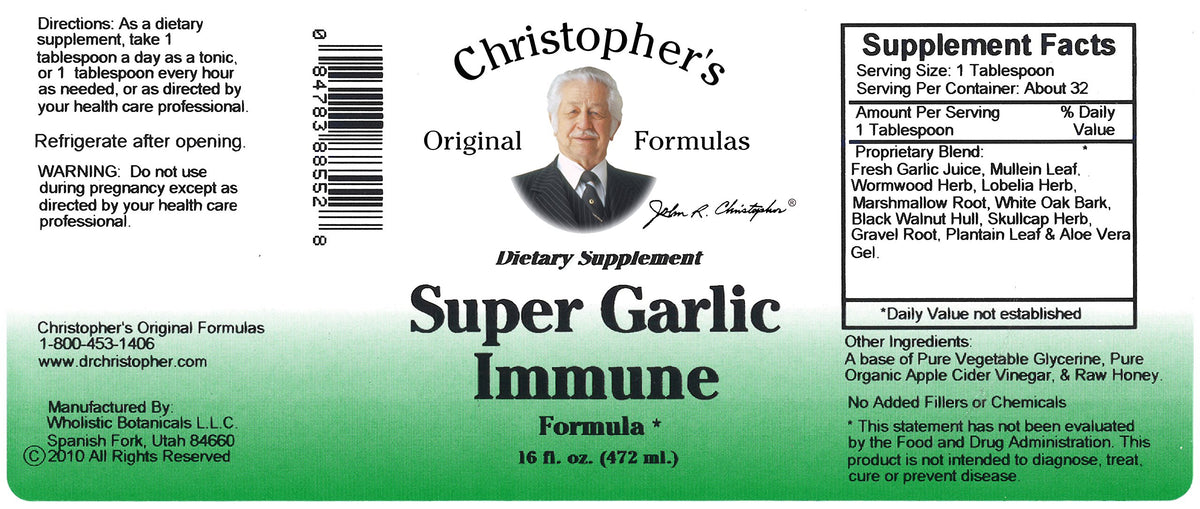 Sirop d'Ail Super Christopher's Original Formulas sur une table en bois