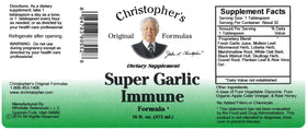 Sirop d'Ail Super Christopher's Original Formulas sur une table en bois