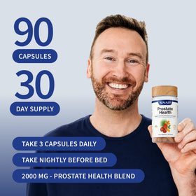 Snap Supplements Prostate, capsules sur une table avec un verre d'eau