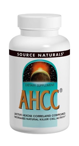 Source Naturals AHCC 500 mg capsules with a measuring spoon