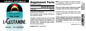 Source Naturals L-Glutamine capsules on a wooden surface