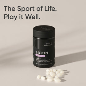 Sports Research Biotine 5 000 mcg gélules végétales sur surface en bois