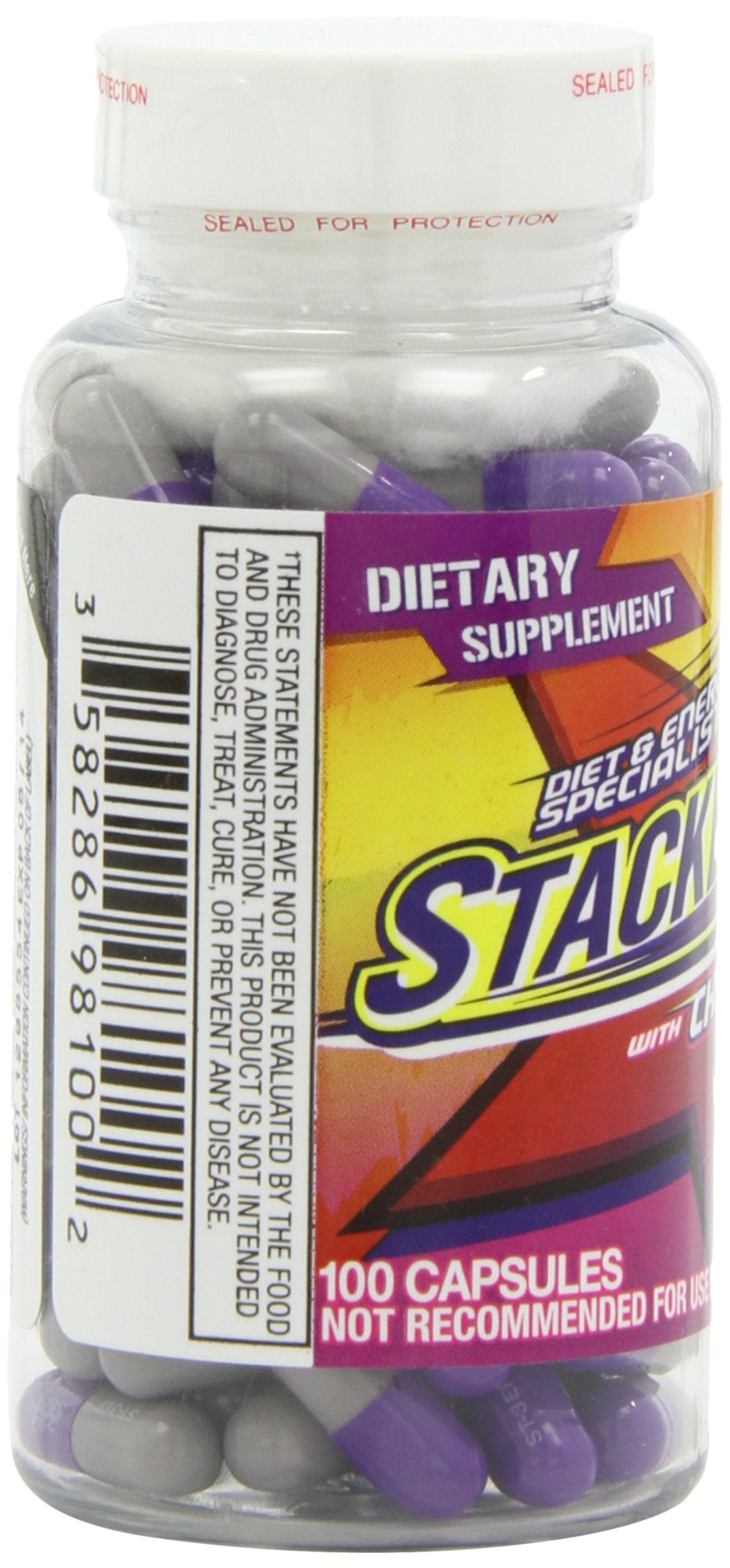Stacker 3 20 capsules sur une table avec un verre d'eau
