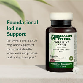 Standard Process Prolamine Iodine comprimés sur une surface blanche