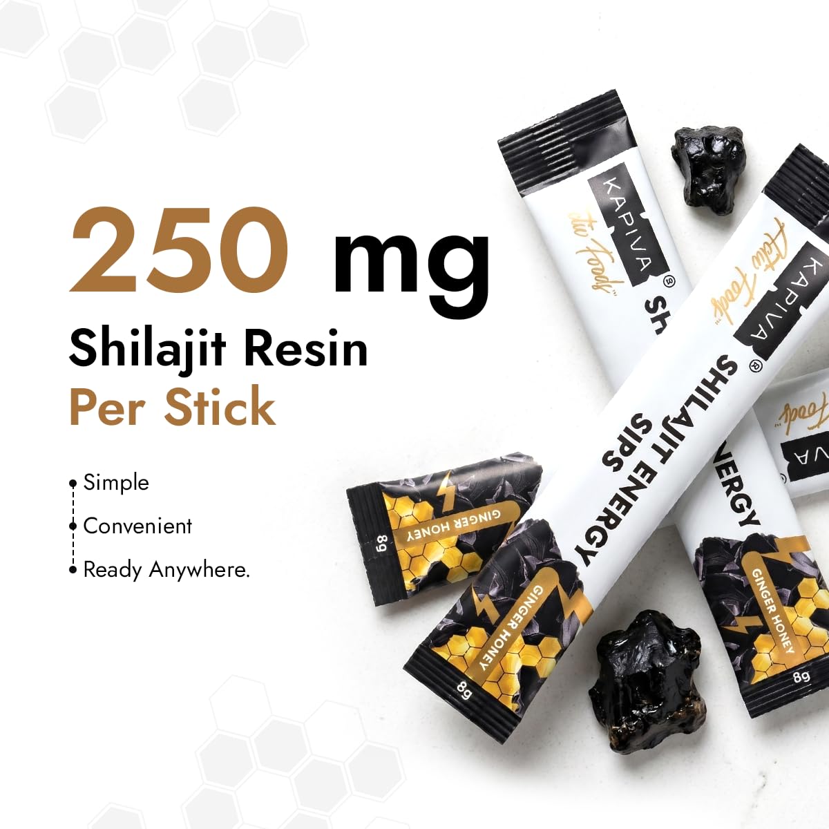 Sticks de miel Kapiva Shilajit sur une table avec d'autres compléments