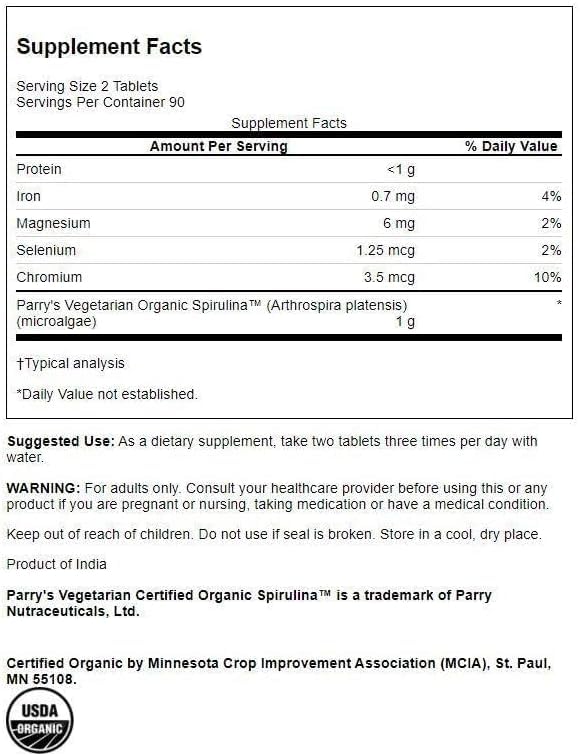 Swanson Spiruline Bio 500 mg 180 Comprimés - Comprimés sur une surface blanche