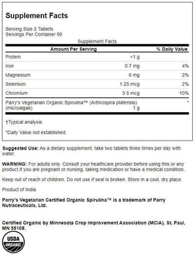 Swanson Spiruline Bio 500 mg 180 Comprimés - Comprimés sur une surface blanche