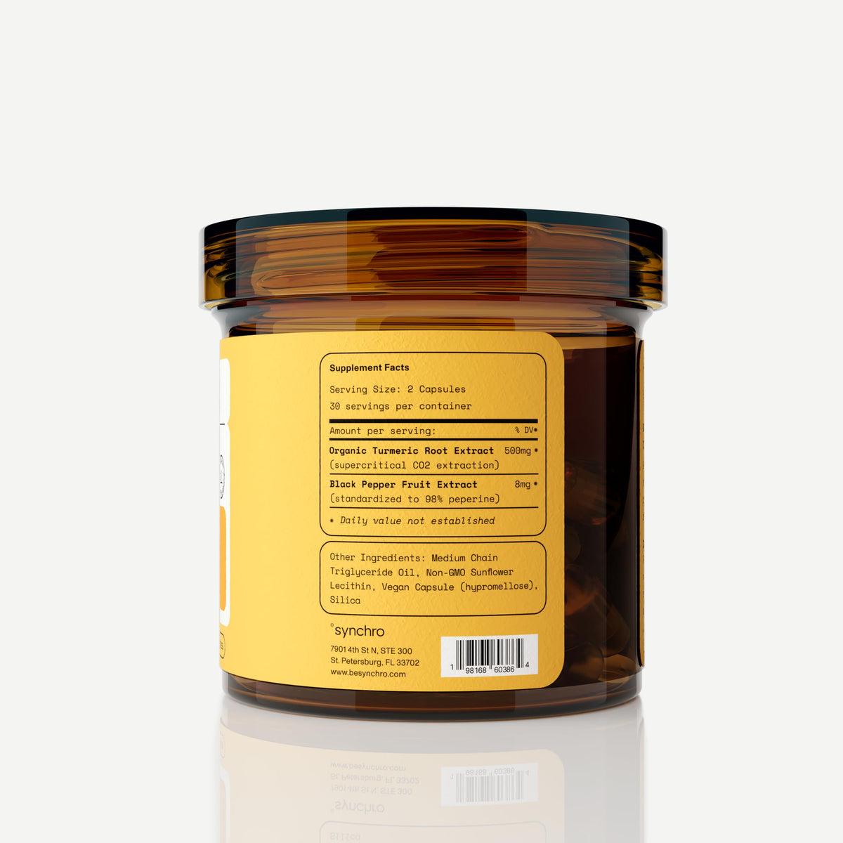 Synchro liposomal curcuma sur une table avec un carnet