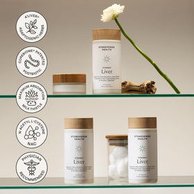 Tablette de capsules Stonehenge Health sur une surface en bois