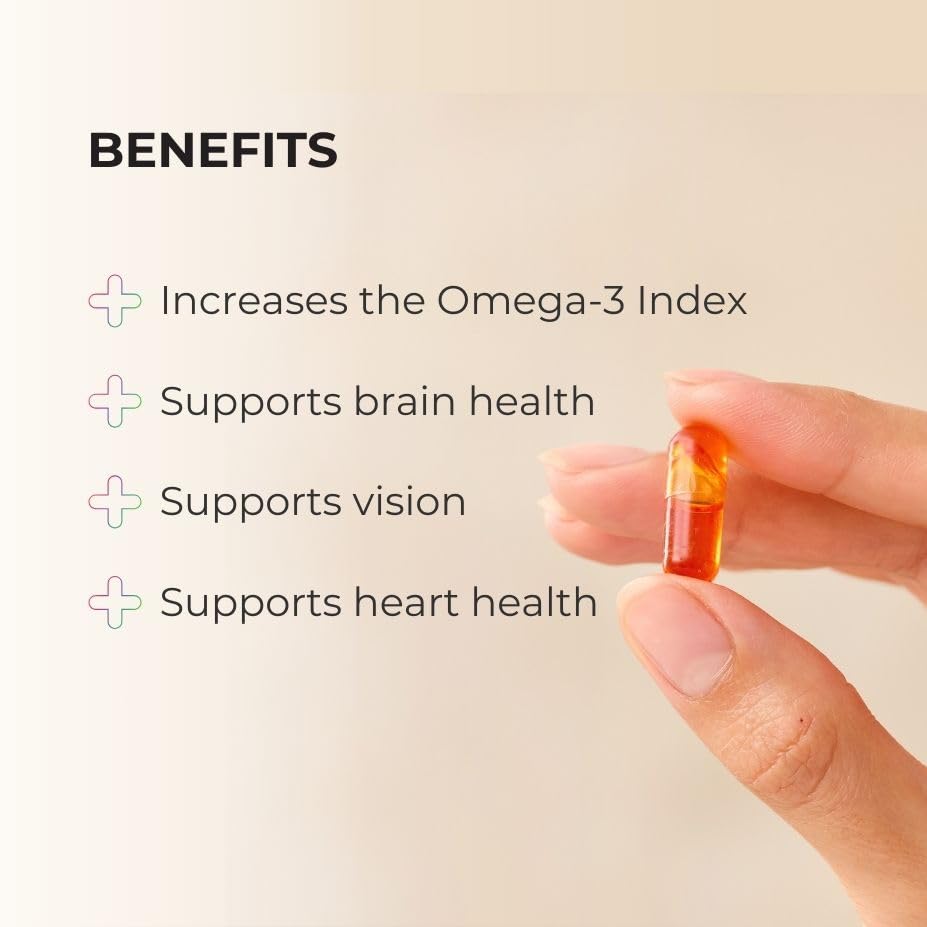 Tablette de Juice Plus+ Omega Blend sur une surface en bois