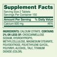 Tablettes de Calcium Citrate 600 mg sur une surface blanche