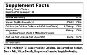 Tablettes de Calcium Magnésium Zinc D3 Amazing Nutrition sur une surface blanche