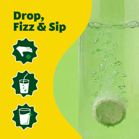 Tablettes effervescentes Amazing Grass avec un verre d'eau et un citron